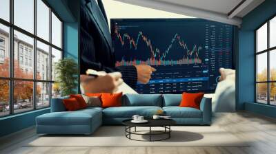 Group of profession trader discuss about stock market investment while point the increasing financial graph displayed on computer. Stock market investment concept Cropped image. Burgeoning. Wall mural