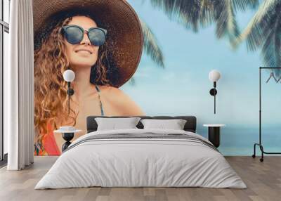 Happy young woman wearing swimsuit at tropical sand beach resort in summer for holiday travel vacation. Wall mural