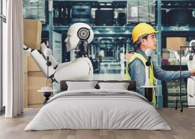 Innovative industry robot working in warehouse together with human worker . Concept of artificial intelligence for industrial revolution and automation manufacturing process . Wall mural