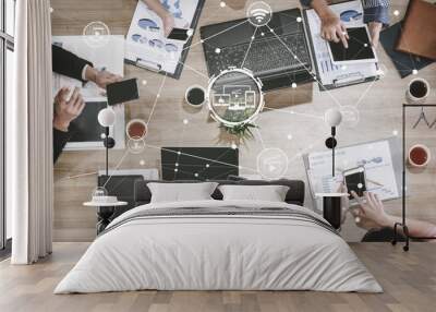 Multimedia and Computer Applications Concept. Business people using technology of digital gadget with modern graphic interface showing social, shopping, camera and multimedia application on device. Wall mural