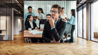 Portrait of happy businessman looking at camera with motion blur background of business people movement in dynamic business meeting. Habiliment Wall mural