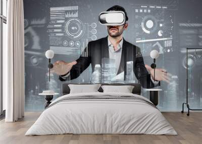 Professional businessman looking at data analysis while using VR glasses. Smart civil engineer designing house construction while wearing visual reality glasses to connect global network. Deviation. Wall mural