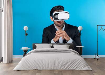 Professional businessman wearing visual reality glasses and suit while sitting. Smart caucasian project manager looking at data analysis by using VR headset. Innovation technology concept. Deviation. Wall mural