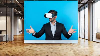 Smart businessman sitting while pointing and choosing data analysis by using technology innovation. Professional caucasian project manager using virtual reality glasses and VR goggles. Deviation. Wall mural