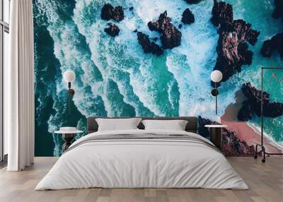 Spectacular drone photo, top view of seascape ocean wave crashing rocky cliff with sunset at the horizon as background. Beautiful coastal scenic landscape with turquoise water beating rocky boulder. Wall mural