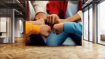 Startup company employee team stacking hand together symbolize successful group of business partnership and strong collective unity teamwork in community workplace in panoramic banner. Synergic Wall mural