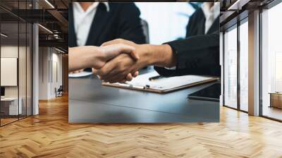 Successful job interview at business office end with handshake as the hired candidate seals the deal with the HR team recruiter by handshaking after successful interview. Panorama shot. Prodigy Wall mural