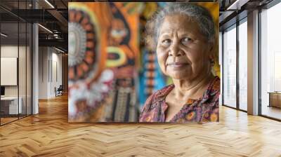 The picture of the australian indigenous female is standing in front of the colourful background and working as community leader, a community leader require communication skill and leadership. AIG43. Wall mural