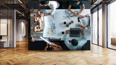 Top aerial view of project manager or civil engineer writing at blueprint and planning building design. Aerial view of architect working together at meeting table with document placed. Alimentation. Wall mural