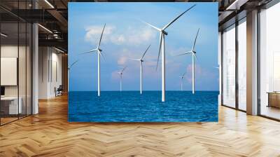 Wind turbine farm power generator in beautiful nature landscape for production of renewable green energy is friendly industry to environment. Concept of sustainable development technology. Wall mural