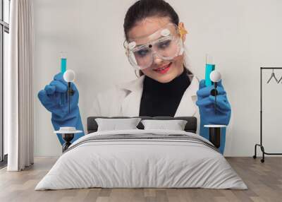 young woman scientist working in chemical laboratory and examining biochemistry lab sample. science  Wall mural