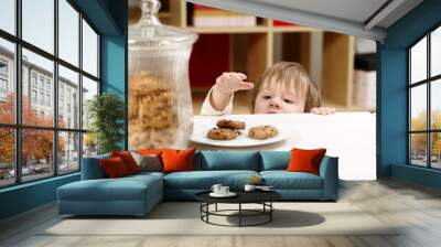 Little boy stealing cookies Wall mural