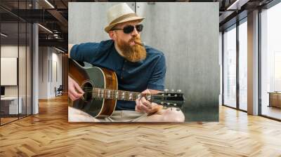 Man with fedora and cigar playing acoustic guitar Wall mural