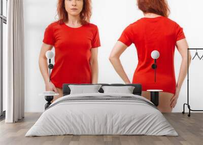 Stunning redhead posing with blank red shirt Wall mural