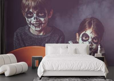 Two kids holding pumpkin buckets at Halloween Wall mural