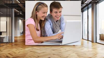 two young students working on a laptop Wall mural