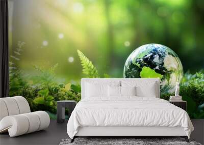 Earth mockup on the field and forest background for green energy and carbon credit concept. Wall mural