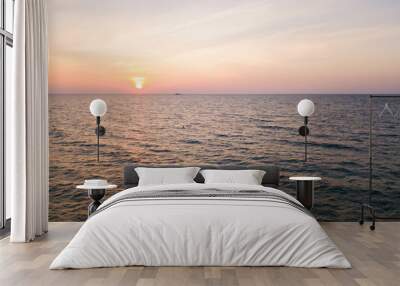 Aerial view of beautiful beach and sea on island at sunset time Wall mural