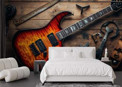 Guitar Maintenance Essentials - Electric Guitar Body, New Strings, and Tools on Wooden Table Top Wall mural