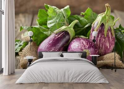 Rustic Charm - Fresh Eggplant on Vintage Wooden Table Wall mural