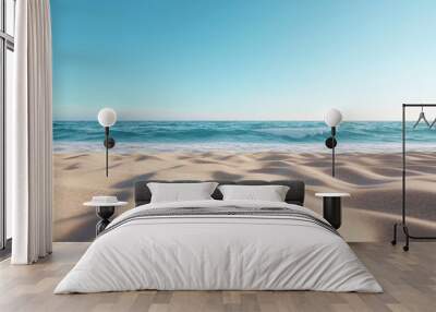 Beach with gentle waves and clear blue sky Wall mural