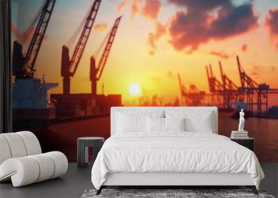 Cargo ship at sunset in harbor Wall mural