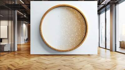 an elegant background with a golden glitter circle on a soft blush pink background. The circle should be subtly positioned in the top right corner, allowing the glitter to catch light and sparkle.  Wall mural