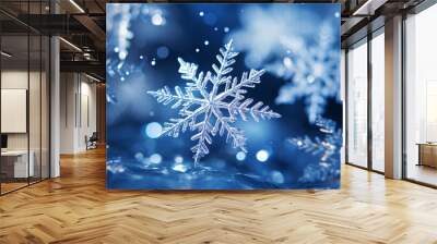 Magical shiny frozen snowflakes and snowfall sky, blue background with beautiful festive light bokeh, winter and Christmas background. Wall mural