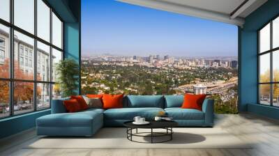 Aerial view towards the skyline of Century City commercial district; downtown area skyscrapers visible in the background; highway 405 and residential area in the foreground; Los Angeles, California Wall mural