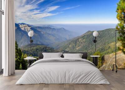 Landscape in Sequoia National Park in Sierra Nevada mountains on a sunny day; smoke from wildfires visible in the background, covering the Fresno area; Wall mural