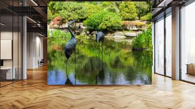 Man made pond surrounded by lush vegetation, Shore Acres State Park Botanical Garden, Oregon Wall mural