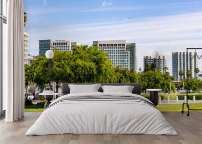 San Jose's downtown skyline as seen from the shoreline of Guadalupe River Park on a sunny spring day; Silicon Valley, California Wall mural