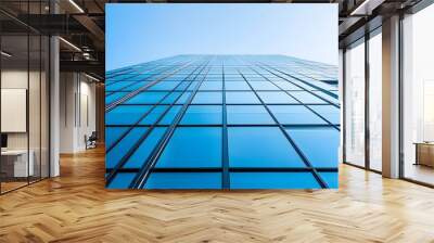 A Low-Angle View of a Modern Glass Skyscraper Wall mural