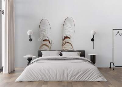 A Pair of White Sneakers on a Person's Feet Wall mural