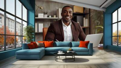 Smiling Black Man Working at a Desk with a Laptop Wall mural