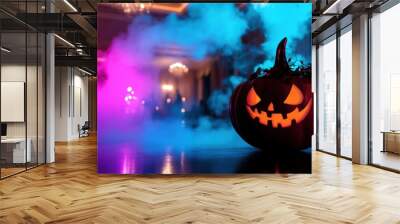 A pumpkin with a scary face is sitting on a table in front of a blue Wall mural