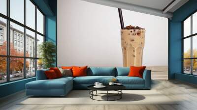 A glass of iced milk tea with brown sugar jelly on wooden table Wall mural