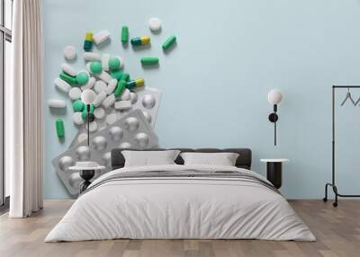 Different pills on a color background Wall mural