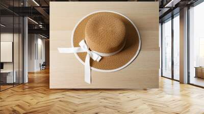 Straw hat on colored background Wall mural