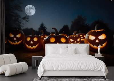 pumpkins with creepy and funny faces, illuminated by the soft light of lanterns, against a background of the moon and starry sky Wall mural