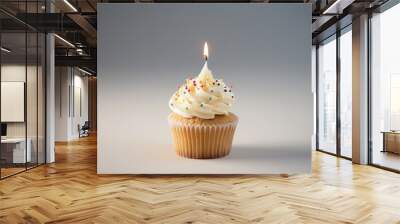 Delicious birthday cupcake with one birthday cake candle on a gray background with copy space for text Wall mural