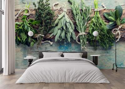 fresh herbs on wooden background with space for text Wall mural