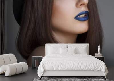 Portrait of beautiful young woman with blue lips and in hat. Bea Wall mural