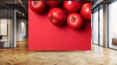 Red apples on red background Wall mural