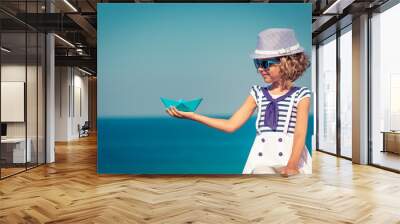 Child enjoys a summer vacation at the sea Wall mural