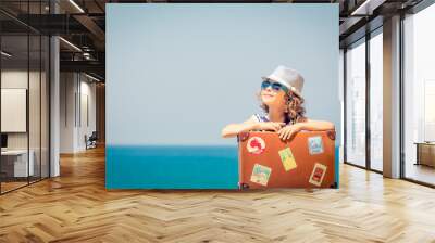 Child enjoys a summer vacation at the sea Wall mural