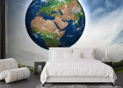 Child holding Earth in hands Wall mural