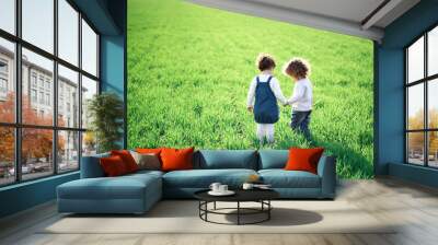 Children in spring field Wall mural