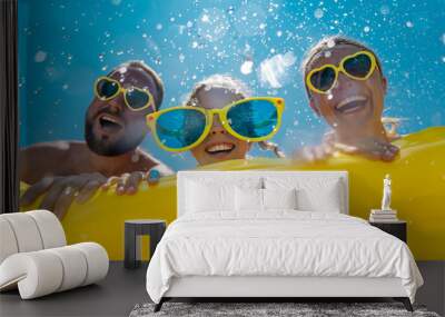 Family having fun on summer vacation Wall mural