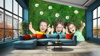 group of happy children playing outdoors Wall mural